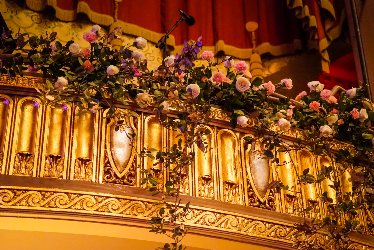 Flowers draping over queen suite in Orpheum.